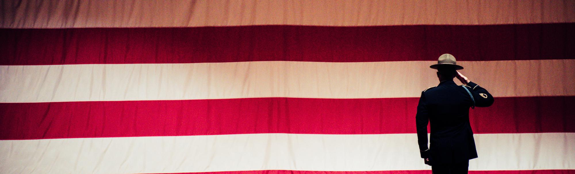 Man standing in front of American flag
